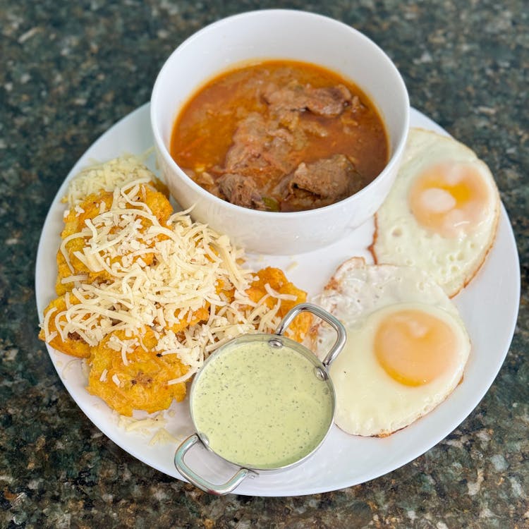 Patacones with eggs and Beef stew  image
