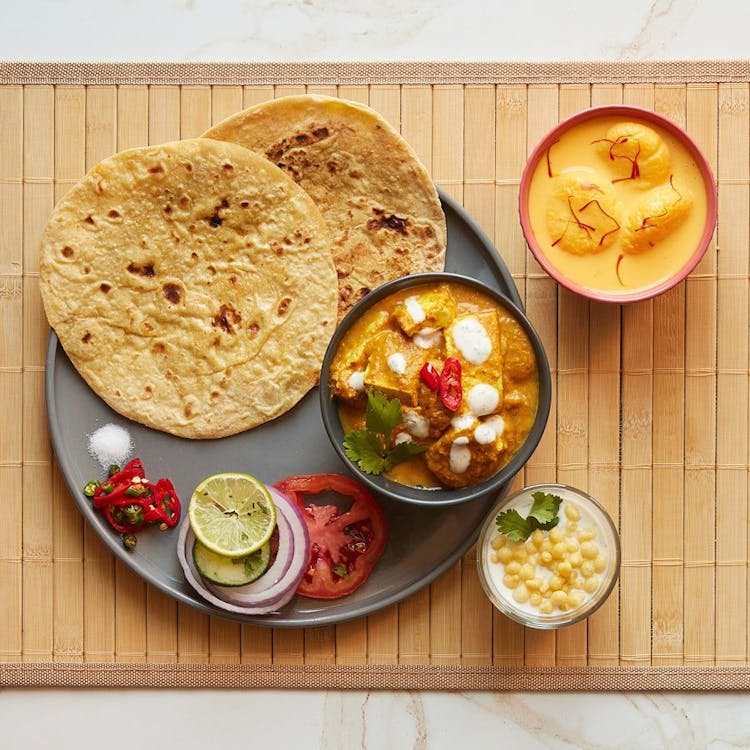 Indian Style Shahi Paneer + 1 Roti + Raita + Dessert  image