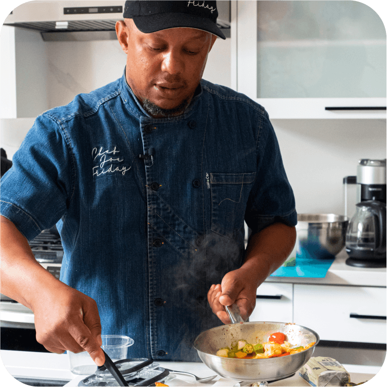Chef cooking meal in a skillet.